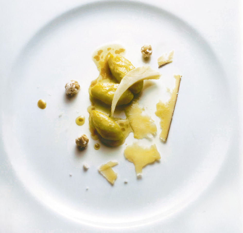 Pompadour potato gnocchi with saffron, artichoke and orange broth, aged Gouda and hazelnuts recipe