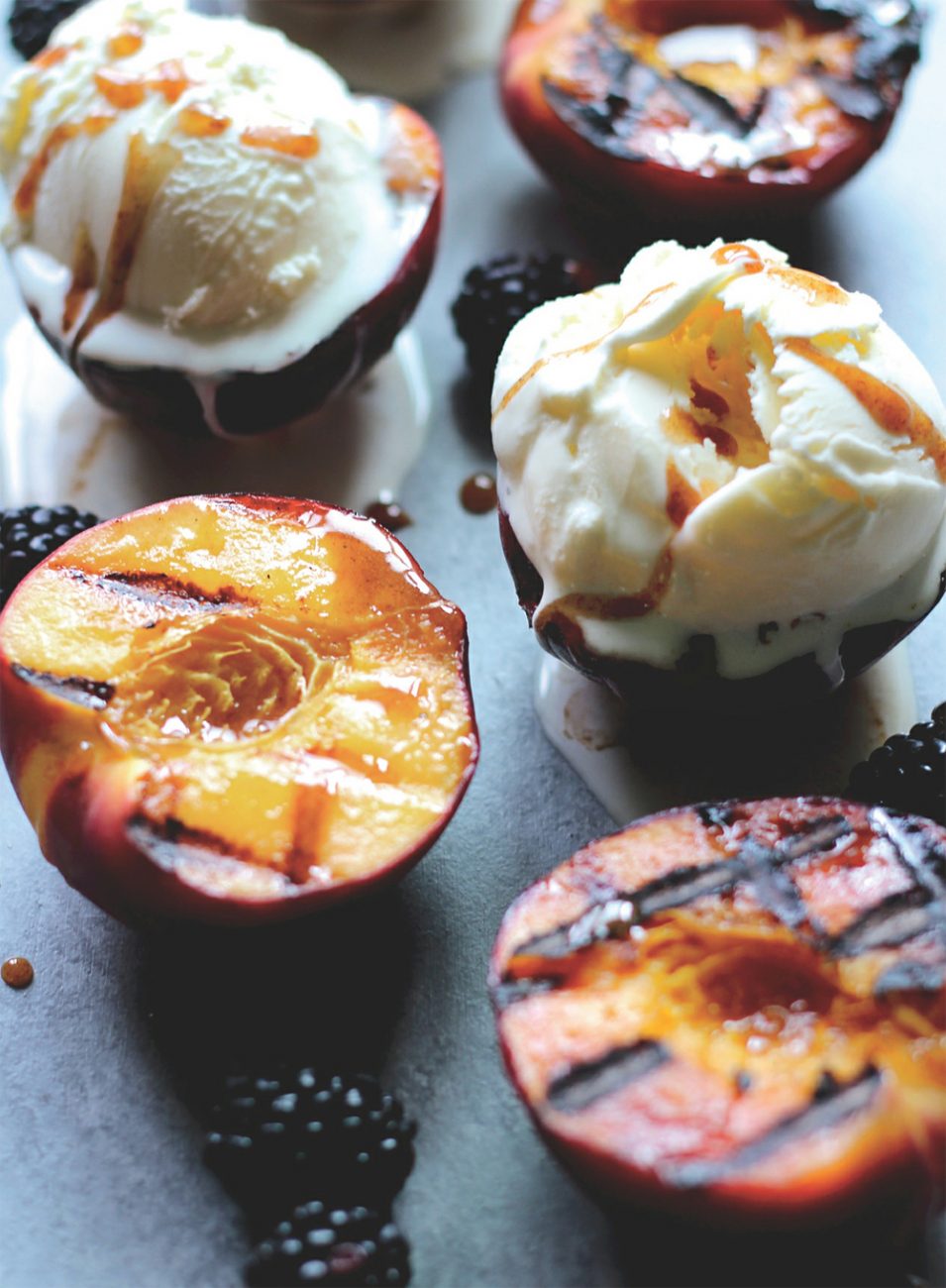 Grilled peaches with spiced honey and blackberries recipe