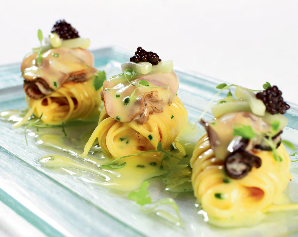 Lightly poached Royal Bay oysters with Sevruga caviar, saffron noodles and lemon butter sauce recipe