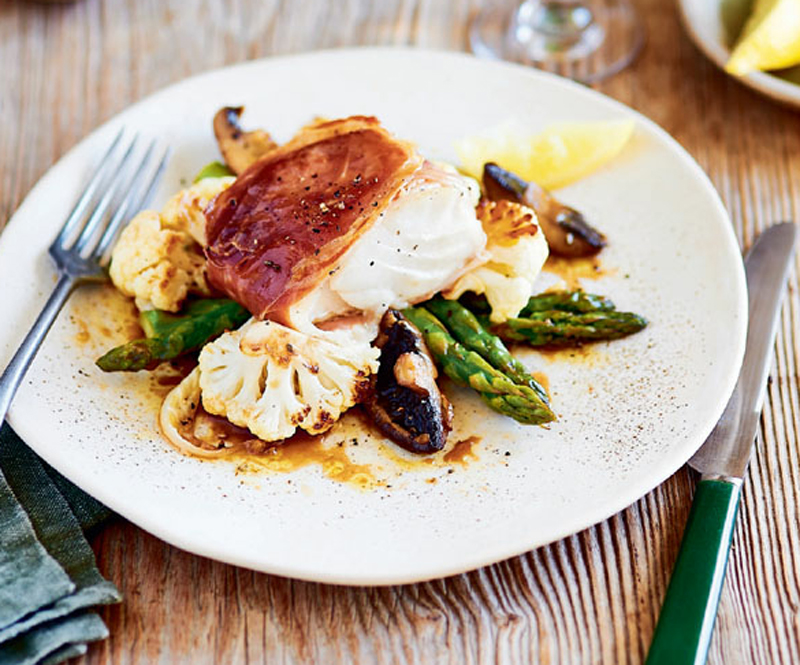 Cod in parma ham with lemon butter and vegetables recipe