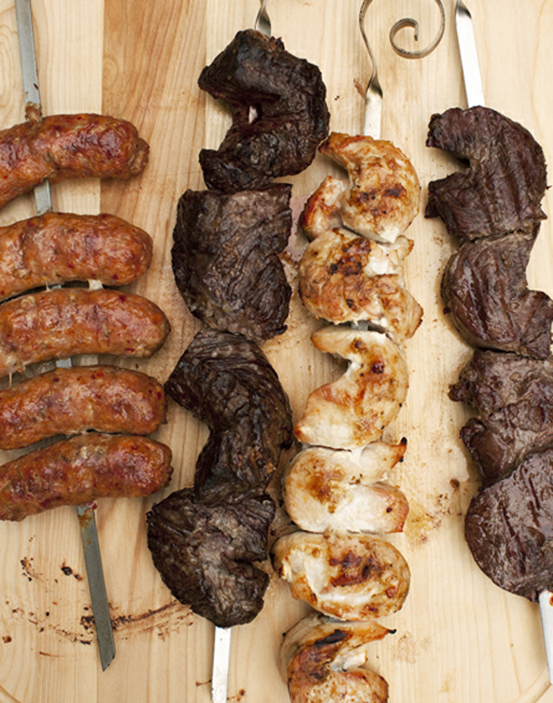 Charcoal-grilled skewers of steak, sausage & chicken recipe