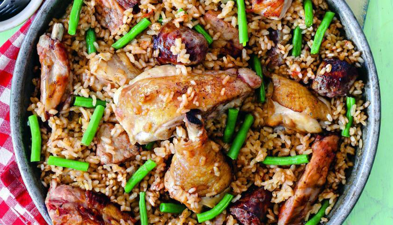 Paella on charcoal with sausages and three kinds of meat recipe