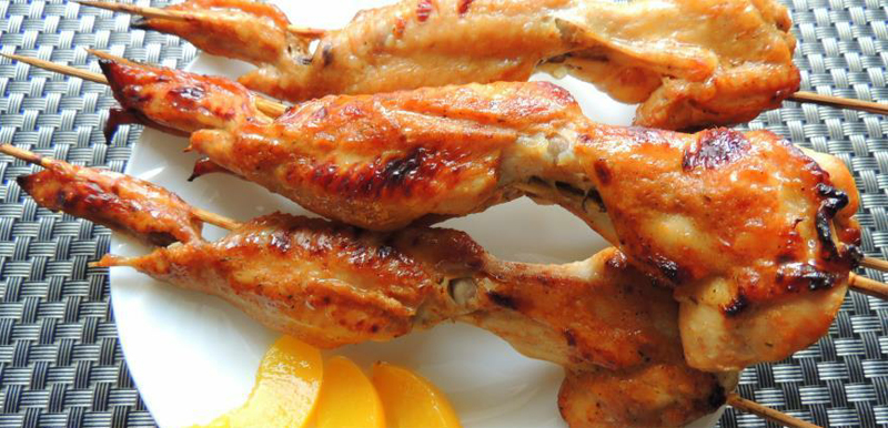 Wings grilled in a peach marinade recipe