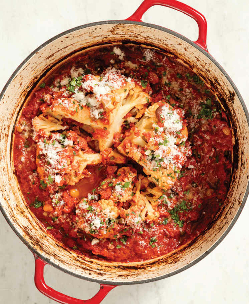 Whole pot-roasted cauliflower with tomatoes and olives recipe